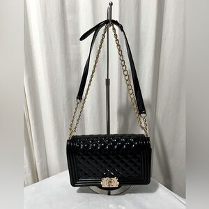 Black quilt shoulder bag with gold chain strap